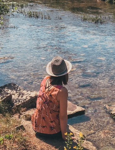Girl sitting along river - Blog