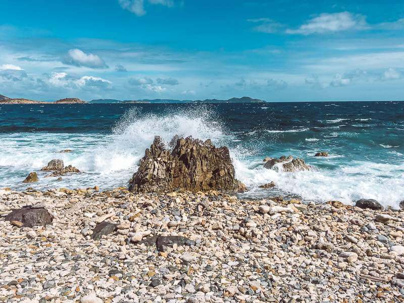 Wild waves crashing against rock at Drunk Bay - things to do in St John USVI