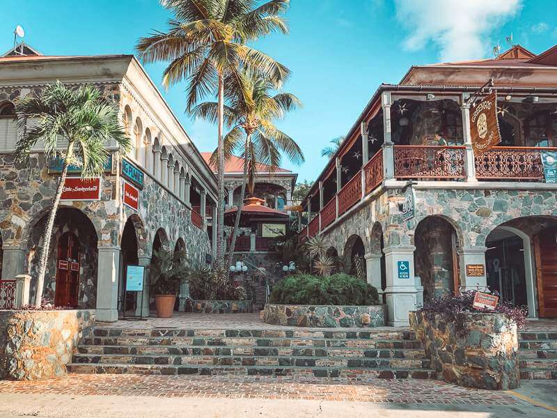 stone and wood exterior of Mongoose Junction shopping complex - things to do in St John USVI