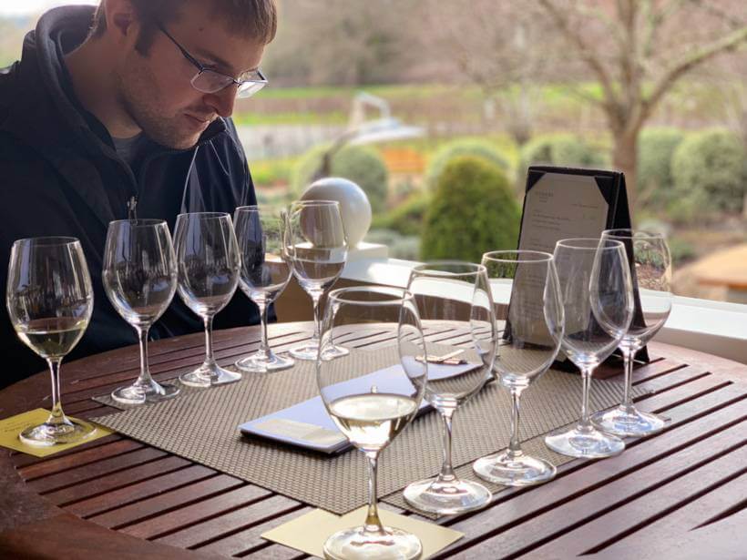 man reading menu at duckhorn - wineries to visit in napa