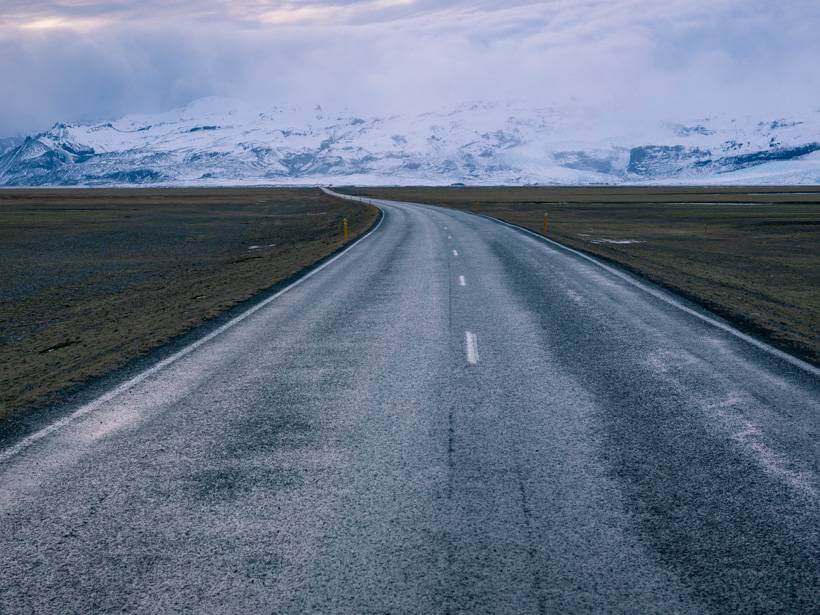 Majestic views of snow-covered mountains on horizon during Iceland road trip