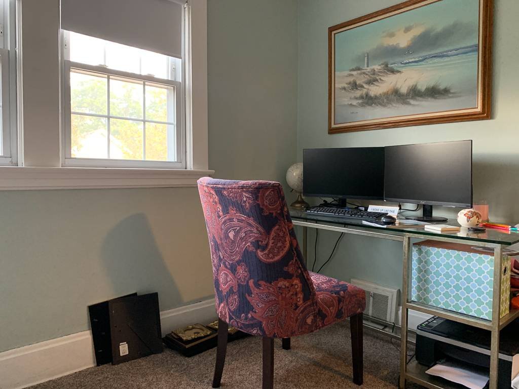 Room with desk, monitors and chair set up