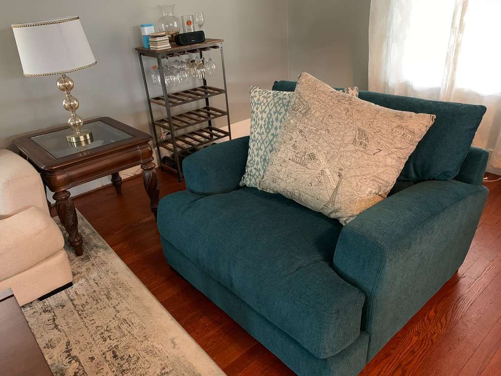 teal extra large chair with paris map pillow
