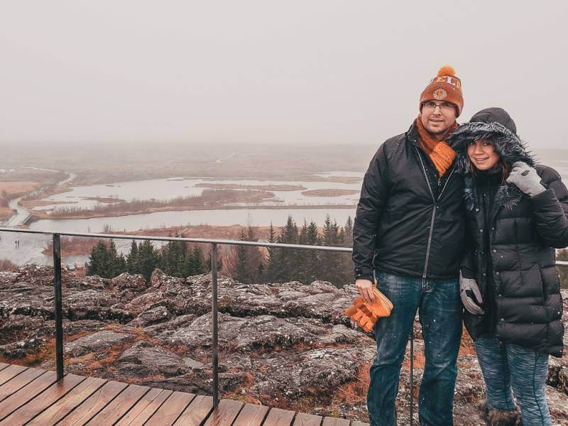 man and woman dressed up for wet conditions - what to wear in iceland in october