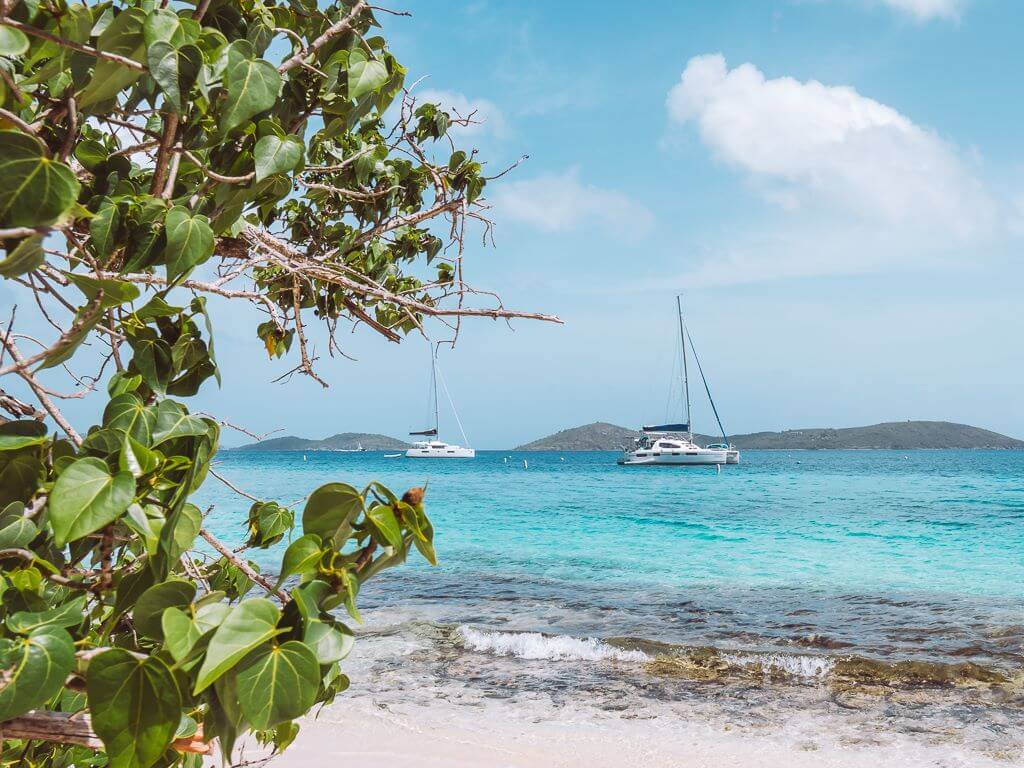 view of boats on the caribbean from honeymoon bay beach in st john