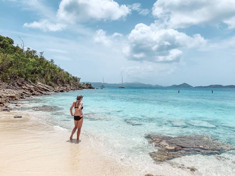 Girl standing alone on Salomon Bay Beach in St John