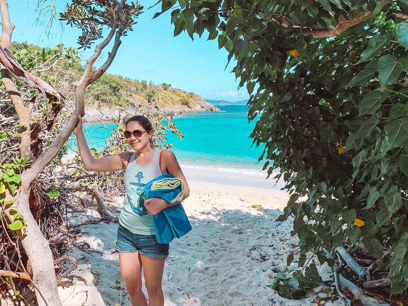 Girl holding beach towel at Jumbie Bay on St John USVI - Christmas Gifts