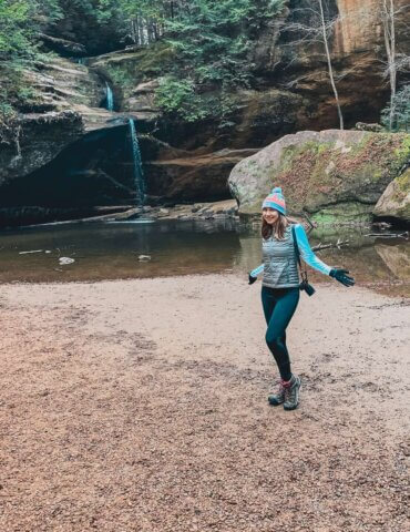 girl standing near waterfall in Hocking Hills