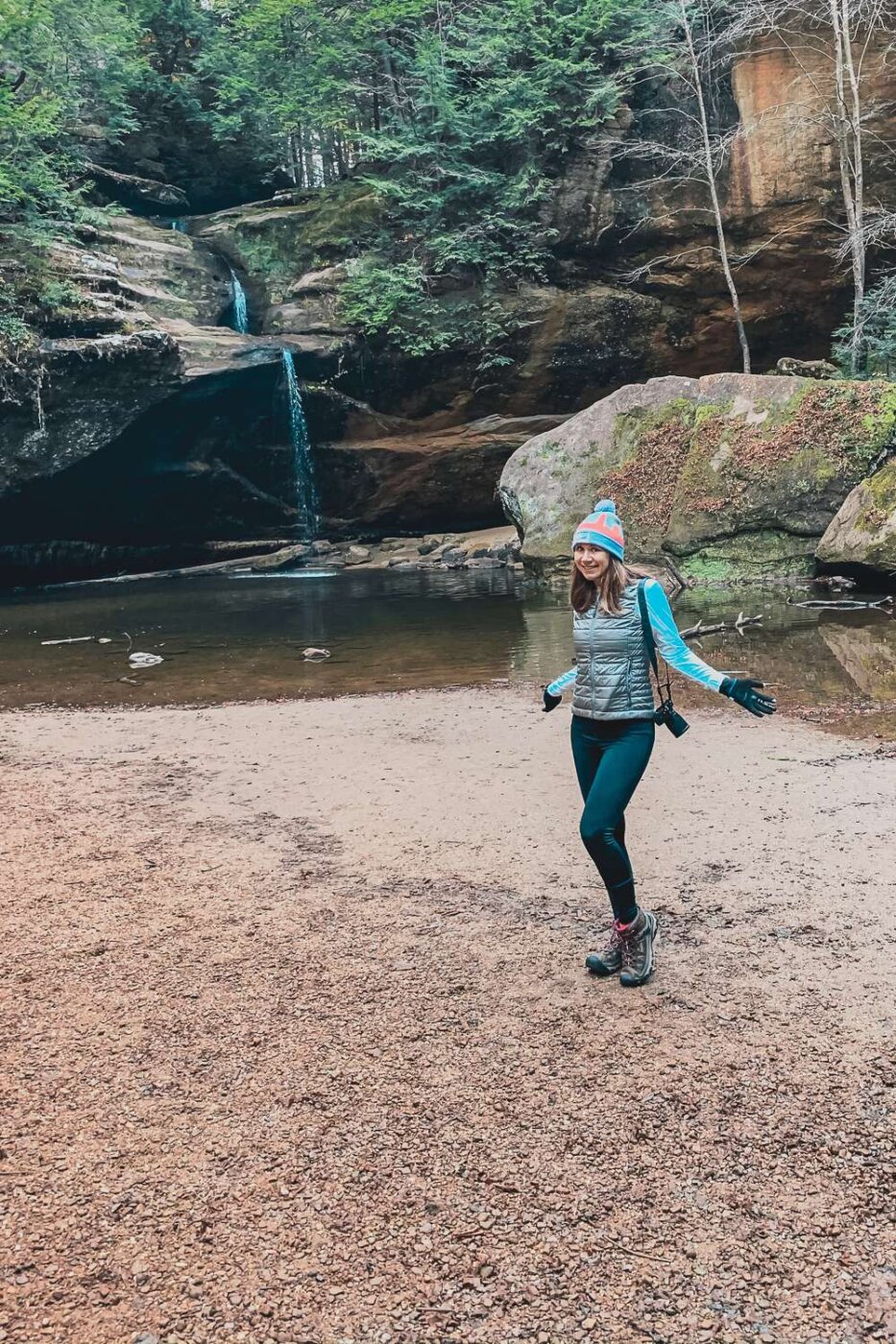 girl standing near waterfall in Hocking Hills