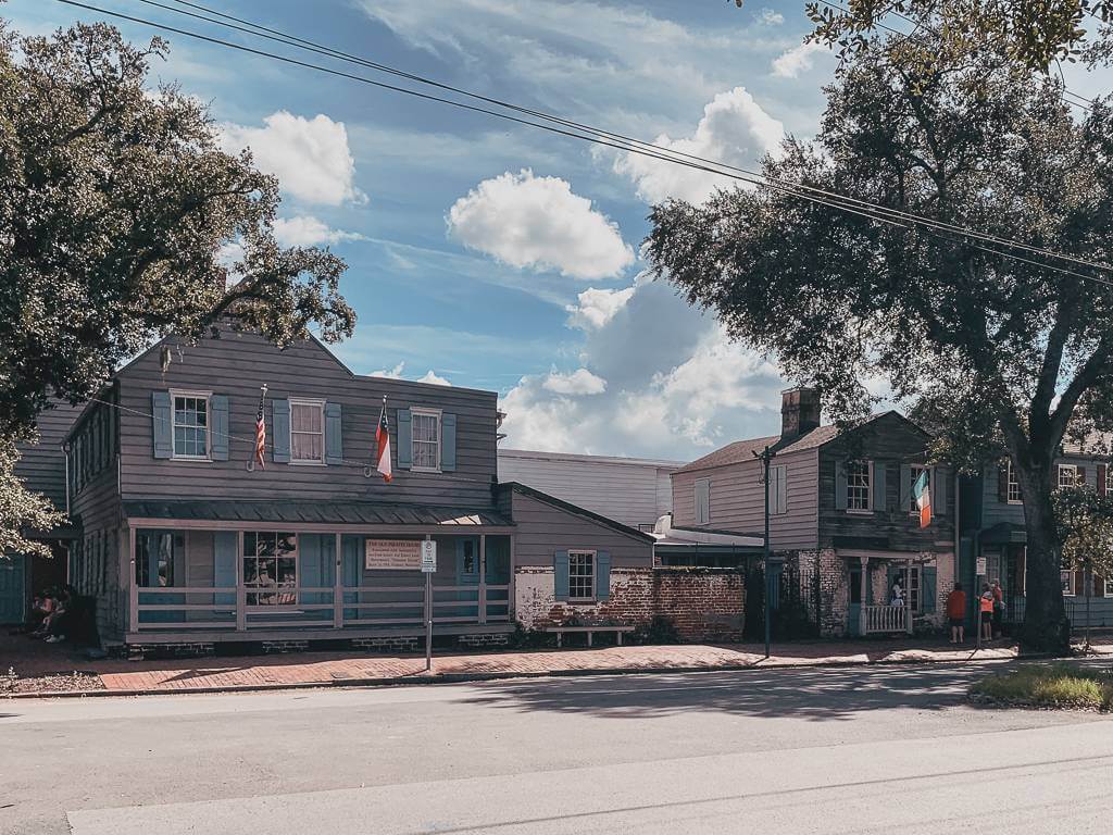 Exterior view of The Pirates' House from across E Broad St - historical sites in Savannah, GA