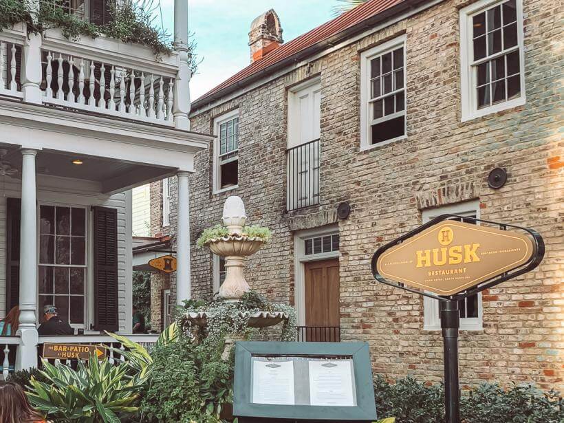 Husk's old house building with double porch and neighboring brick bar