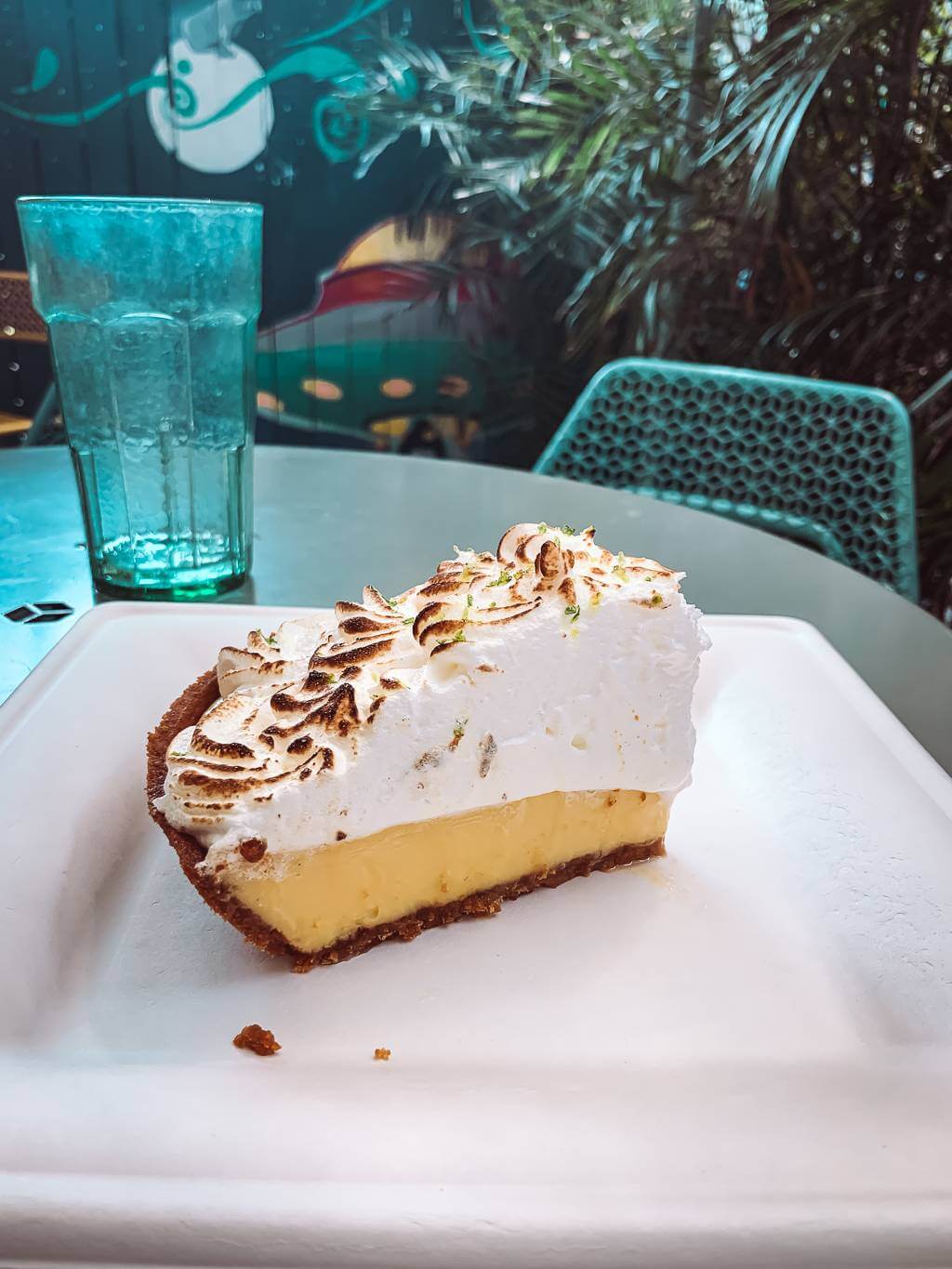 Key lime pie from Moon Dog Cafe with thick layer of merengue sitting on white plate