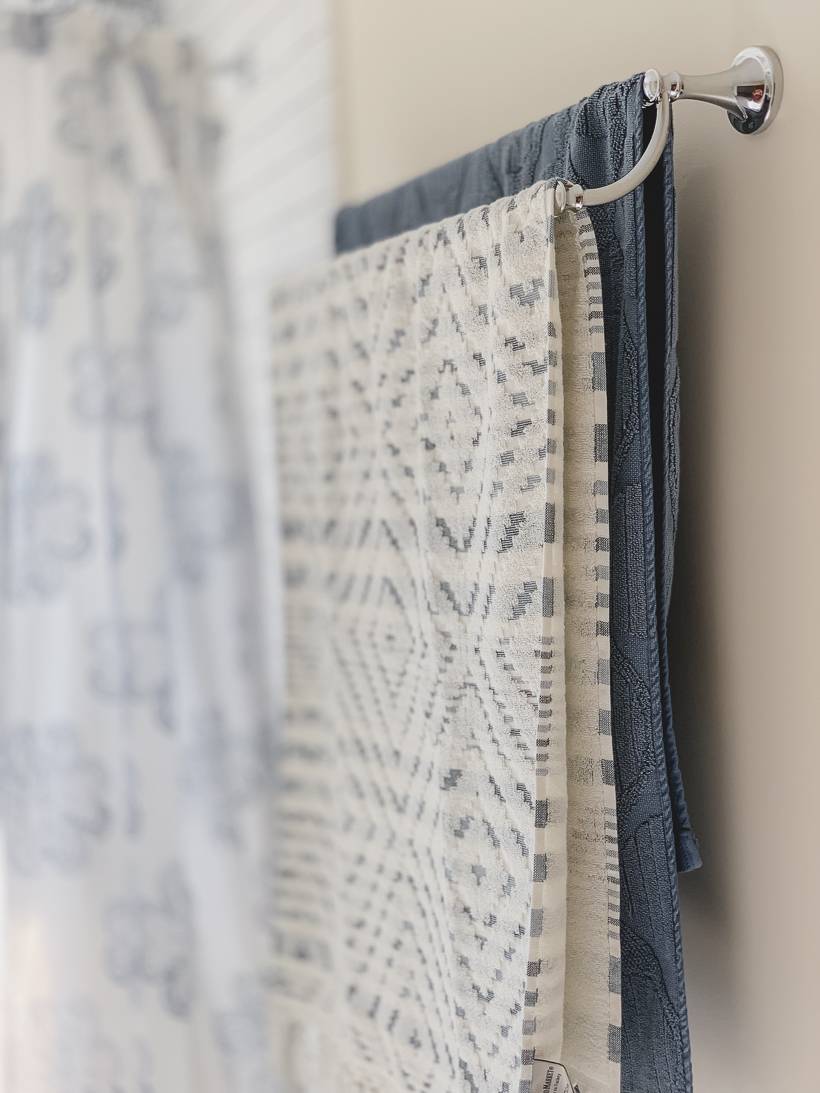 cream and blue towels for Greece inspired bathroom