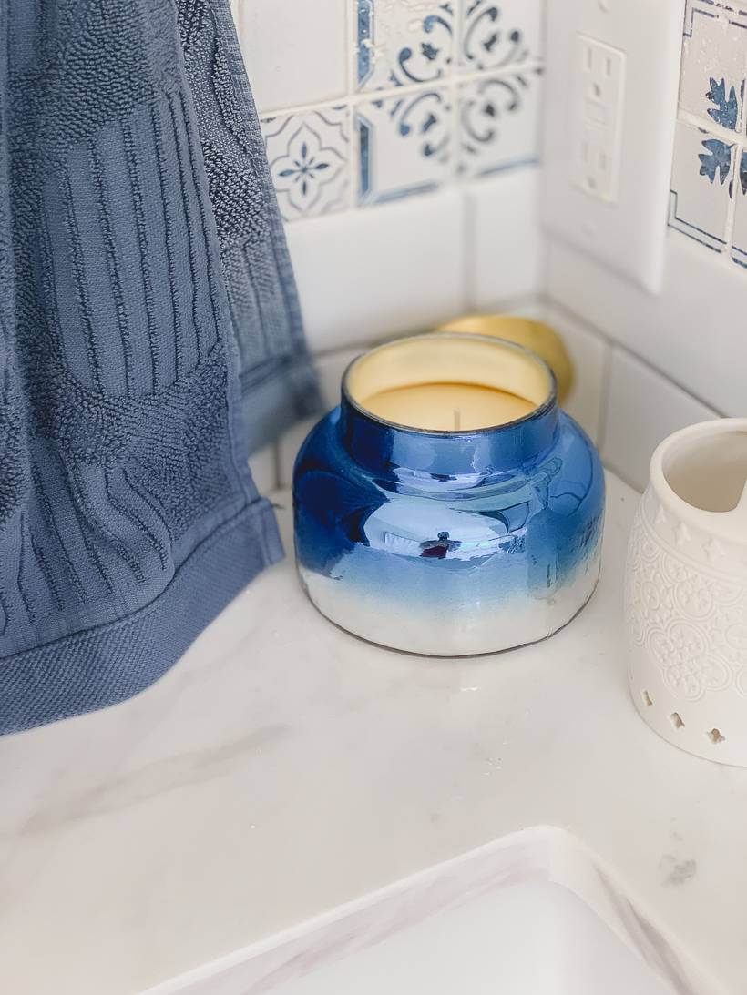 Capri Blue candle from Anthropologie in Greece inspired bathroom