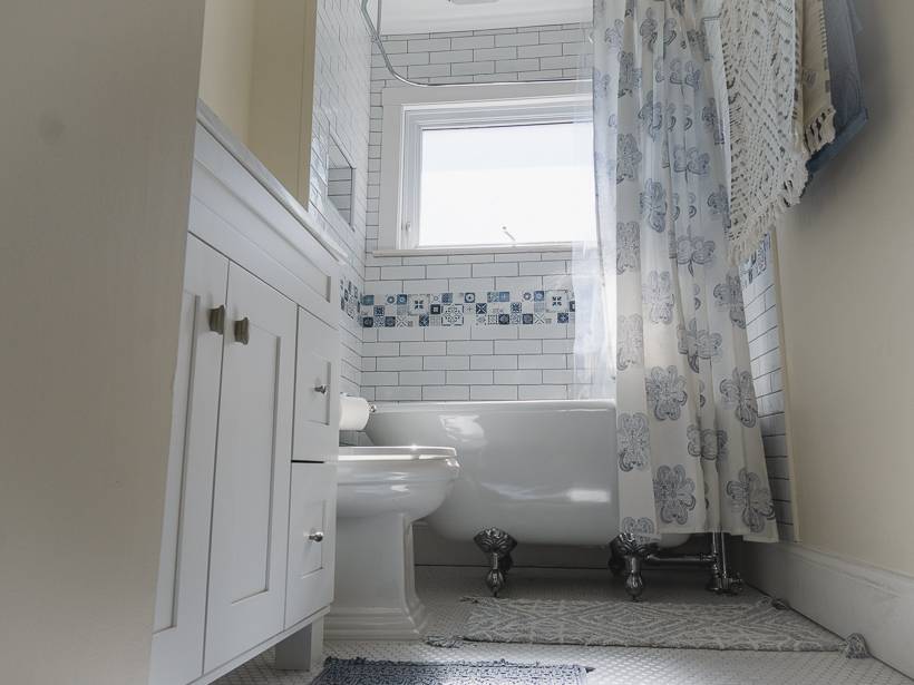 View from below of claw foot tub with chrome fixtures