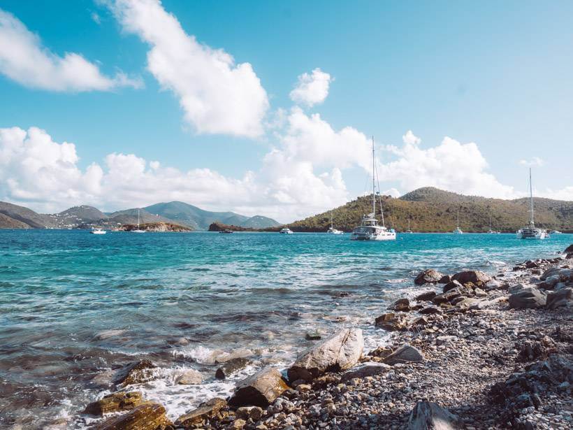 Rocky path of Leinster Bay Trail with views out to the BVI and boats on the horizon