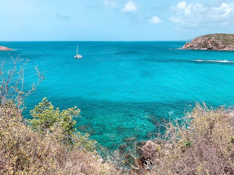 View of bright Caribbean blues during hike on my first solo trip