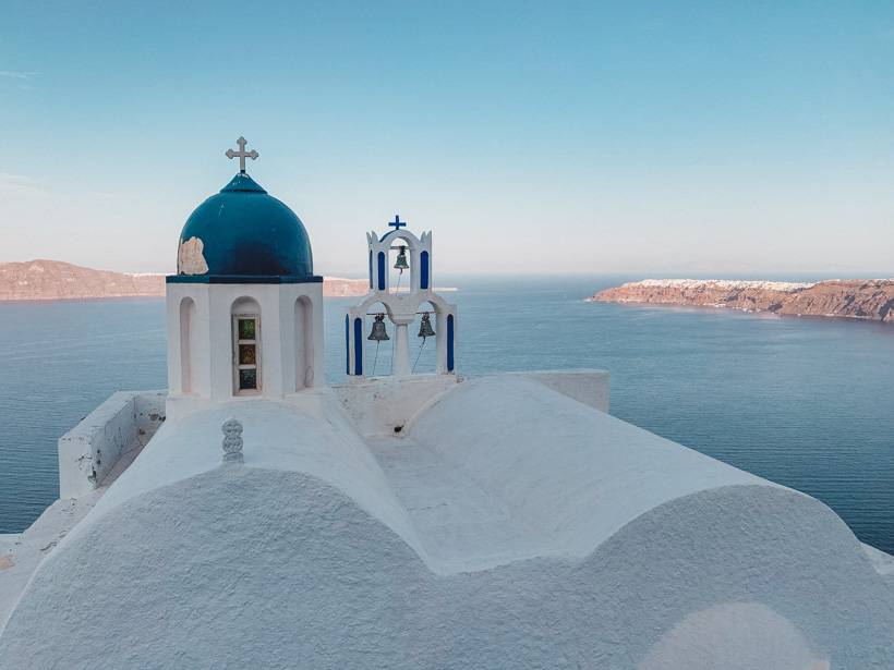 View of the Aegean from the white church on the Skaros Rock in Santorini Greece
