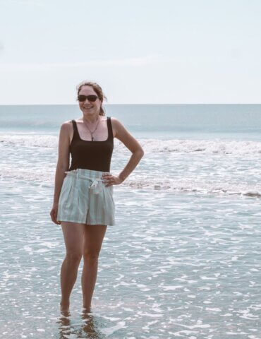 girl standing in gentle waves at Isle of Palms