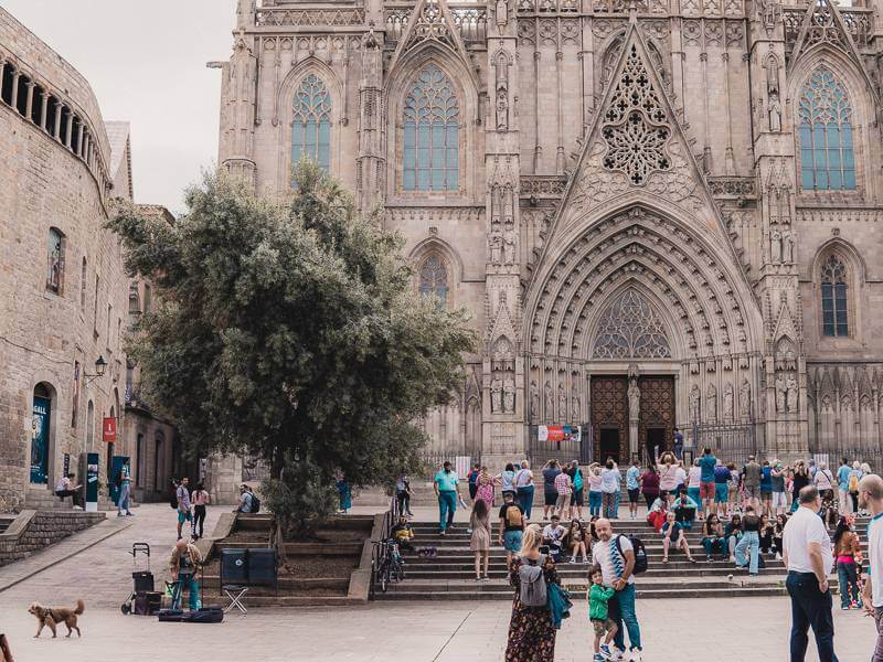 Tourists in front of Gothic facade of Barcelona Cathedral during 2 day itinerary