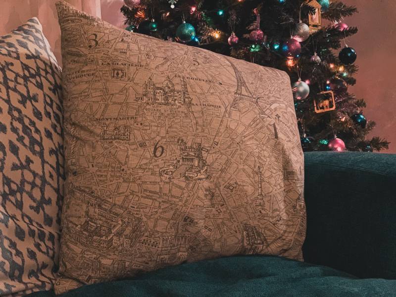 large throw pillow with Paris map in front of Christmas tree - gifts for map lovers