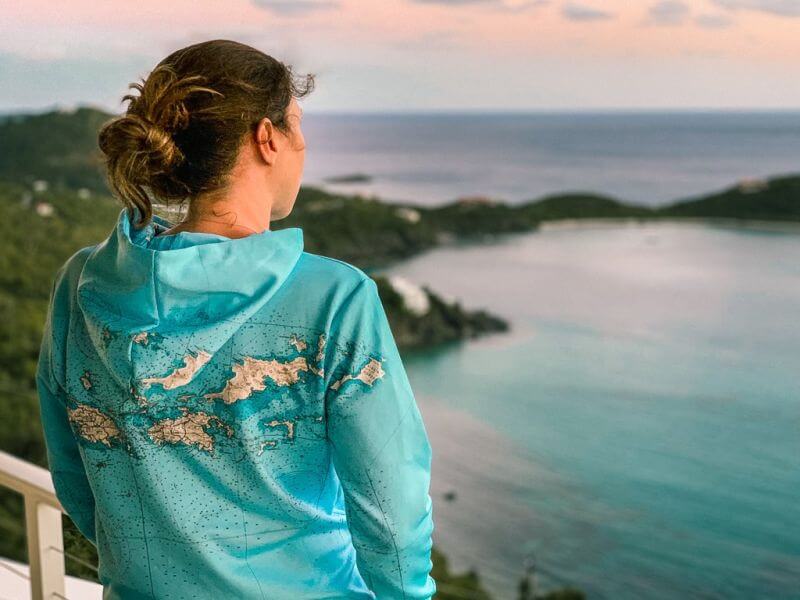 Girl wearing Virgin Islands map sweatshirt looking out over the Caribbean Sea - gifts for map lovers