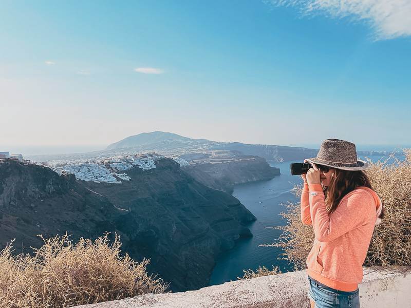 girl in pink sweatshirt taking a photo of Fira with Sony camera