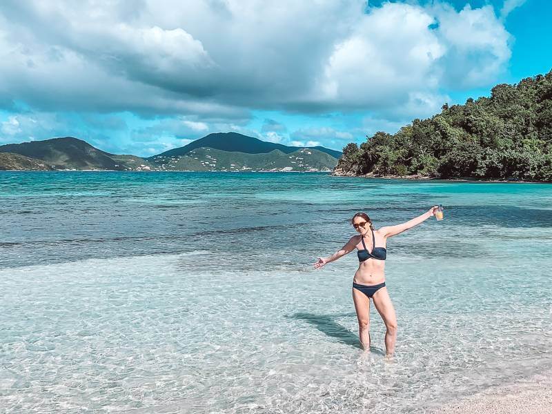 girl standing in shallow clear water at Brown Bay