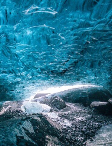 Bright blue ice on and ice cave tour in Iceland