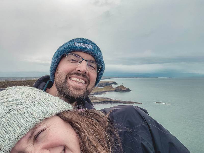 Couple being silly while taking photographs near giants causeway - antrim coast northern ireland