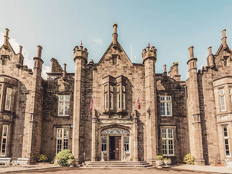 Honey-colored stone facade of Belleek Castle in Ireland