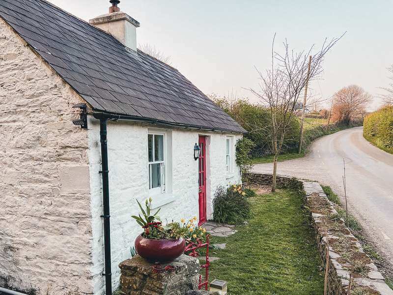 While stone cottage off road near Kinsale in Ireland