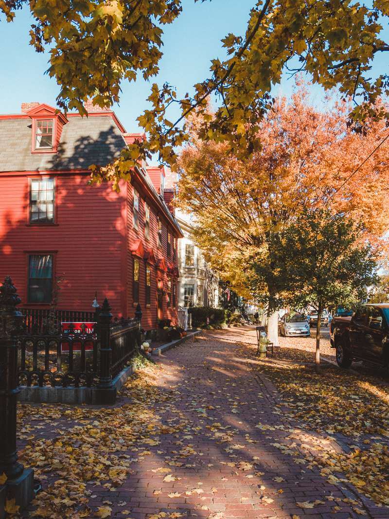 Beautiful fall foliage around red house - trip to Salem MA