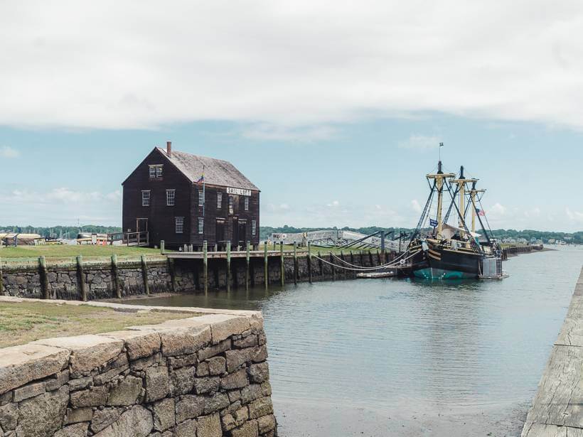 View of supply house and ship docked in harbor - trip to Salem MA