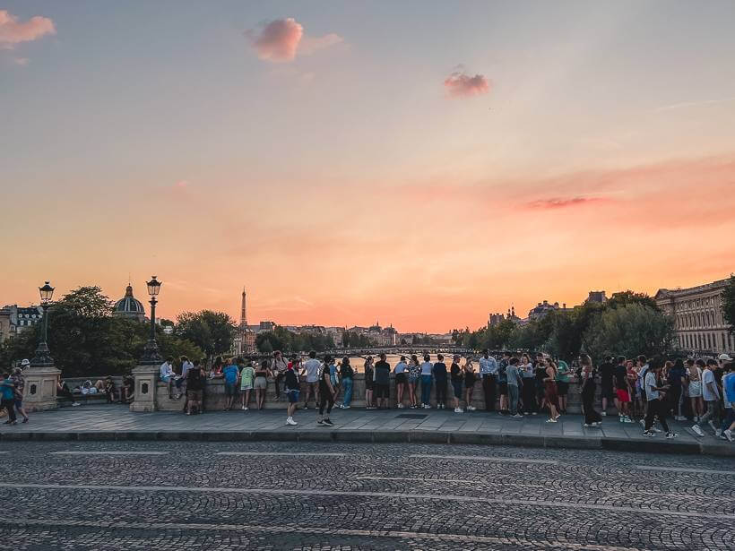 Sun setting over the Seine from Pont Neuf on Bastille Day in Paris