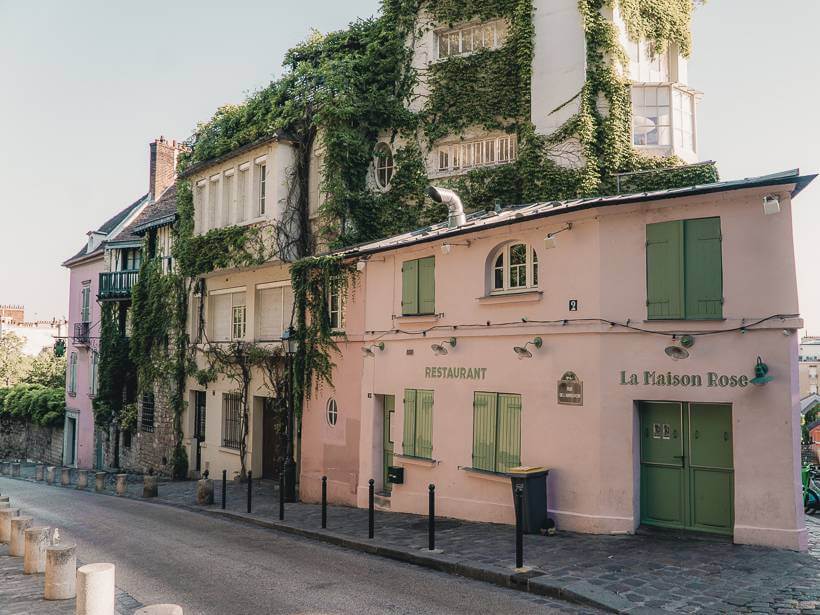 Pink exterior facade of La Maison Rose cafe in Montmartre during morning walk