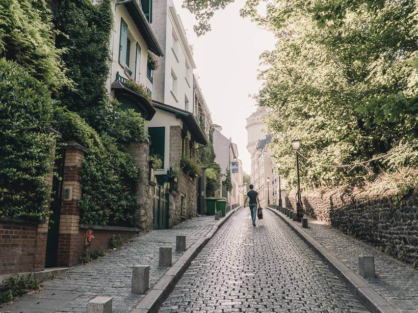 Shady cobblestone path down Rue Cortot