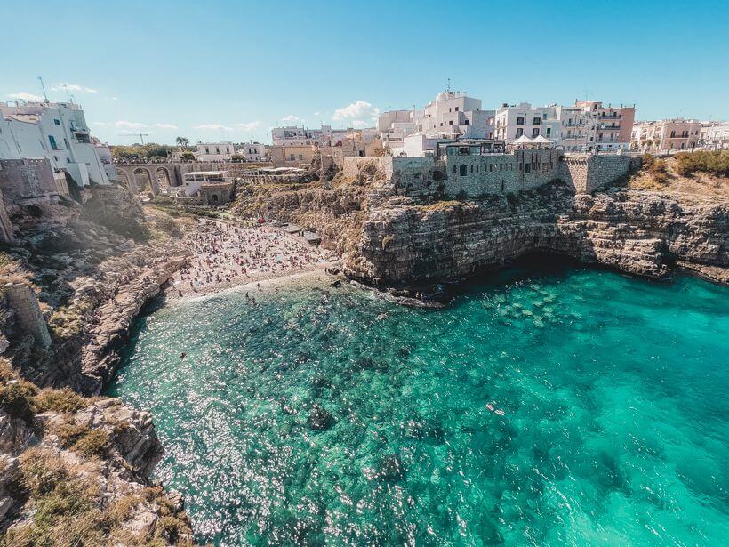 Glittering emerald and turquoise tones in the water at Polignano a Mare