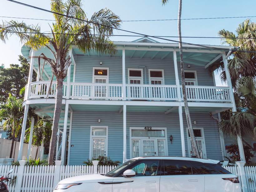 Bright blue Airbnb with wraparound balcony - Key West trip cost
