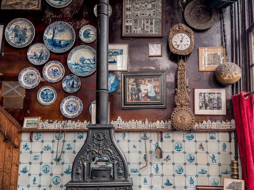 Gallery wall with Delftware during a food tour in Jordaan