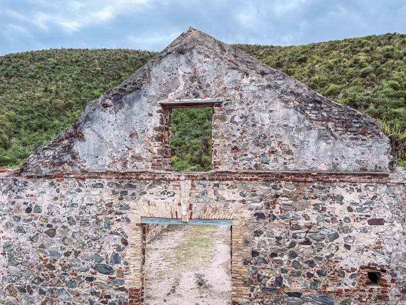 Lush hill behind the boiling room of a Caribbean sugar mill plantation