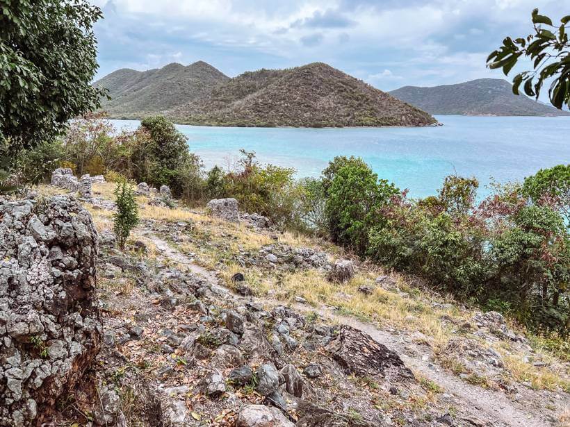 stone rubble of the slave quarters at Annaberg Plantation with Leinster Bay in the background
