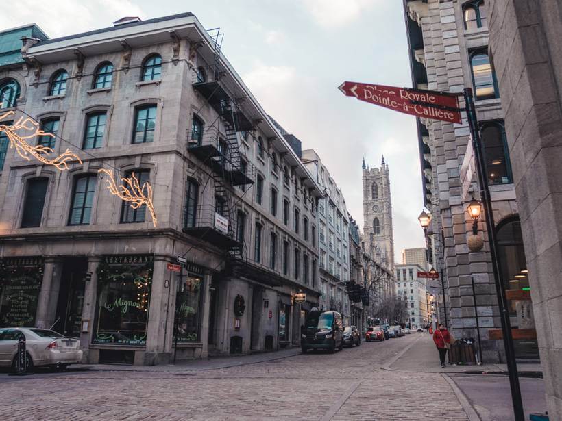 View of Notre Dame Basilica in Montreal from Rue Pointe a Calliere - solo travel Montreal