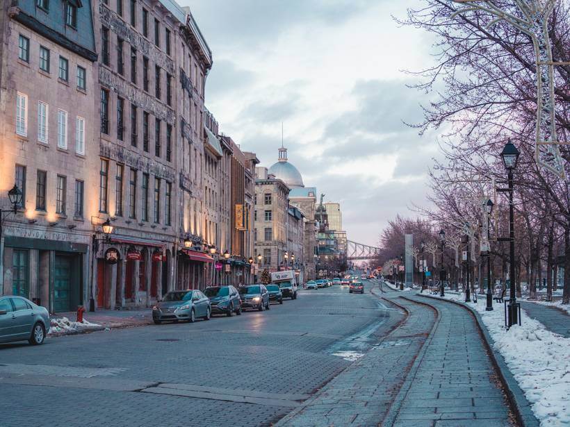 Street view of Rue Commune in Old Montreal during dusk in wintertime