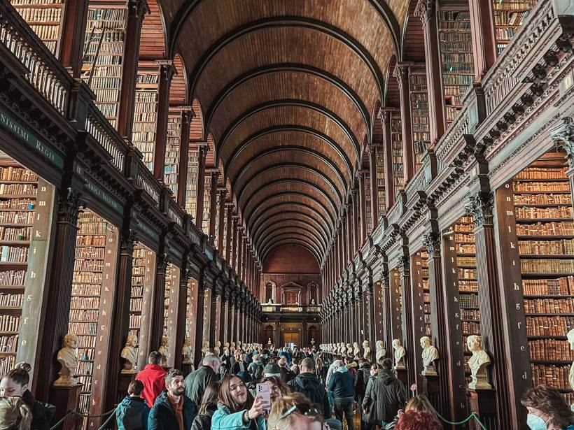 Rows of two story wooden bookcases at the Old Library at Trinity College - Ireland road trip
