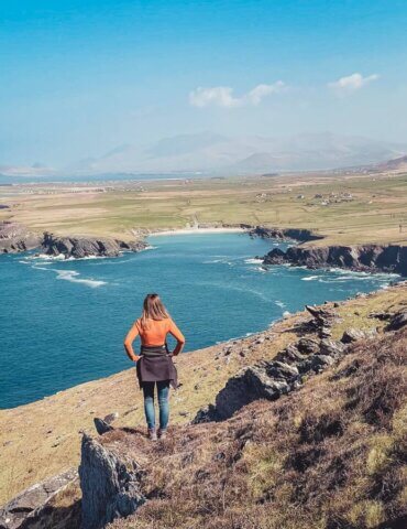 Girl appreciating views of the North Atlantic from the Dingle Peninsula during an Ireland road trip