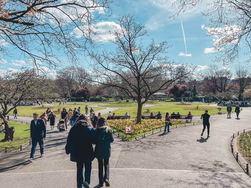 People walking around St Stephens Green on a sunny March day