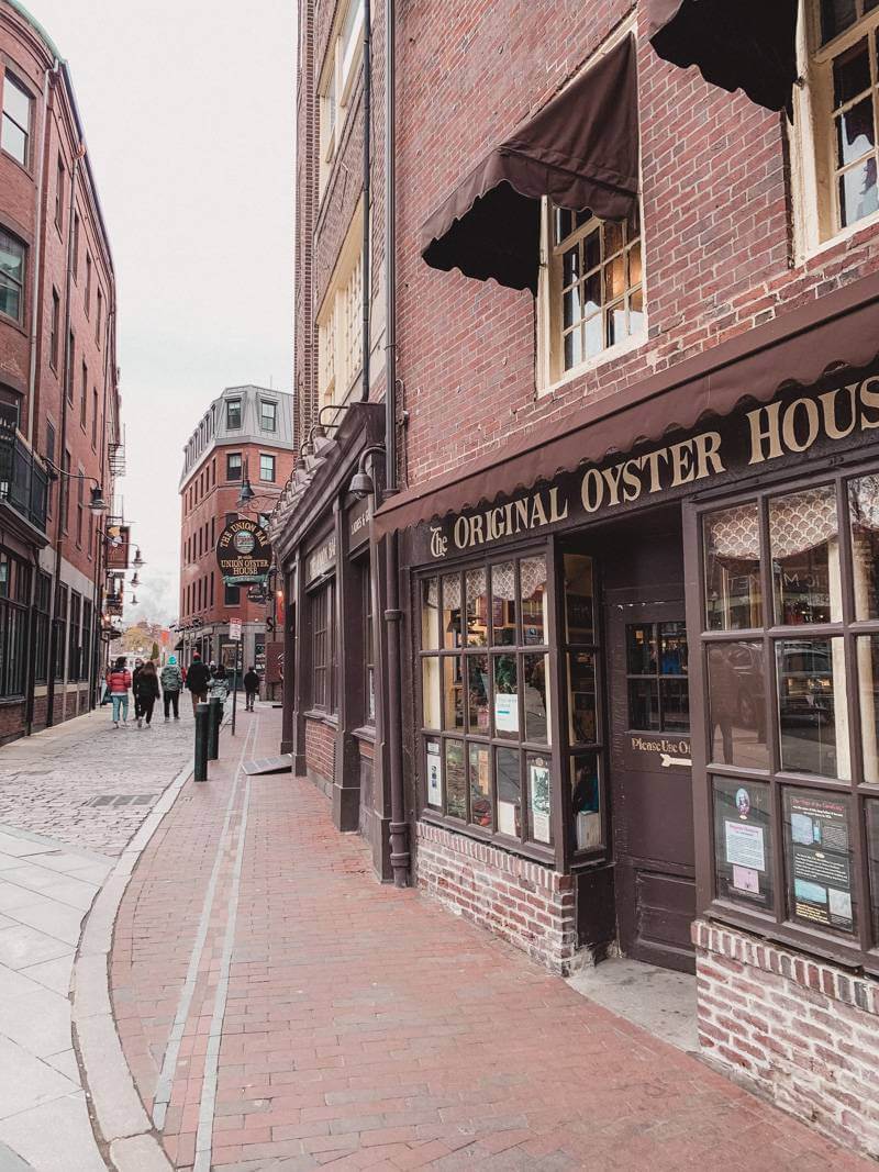 Brick and brown awning exterior of Union Oyster House in Boston, MA