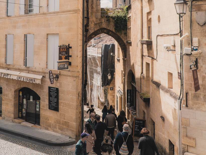 Stone archway in narrow alley of La Porte de la Cadene
