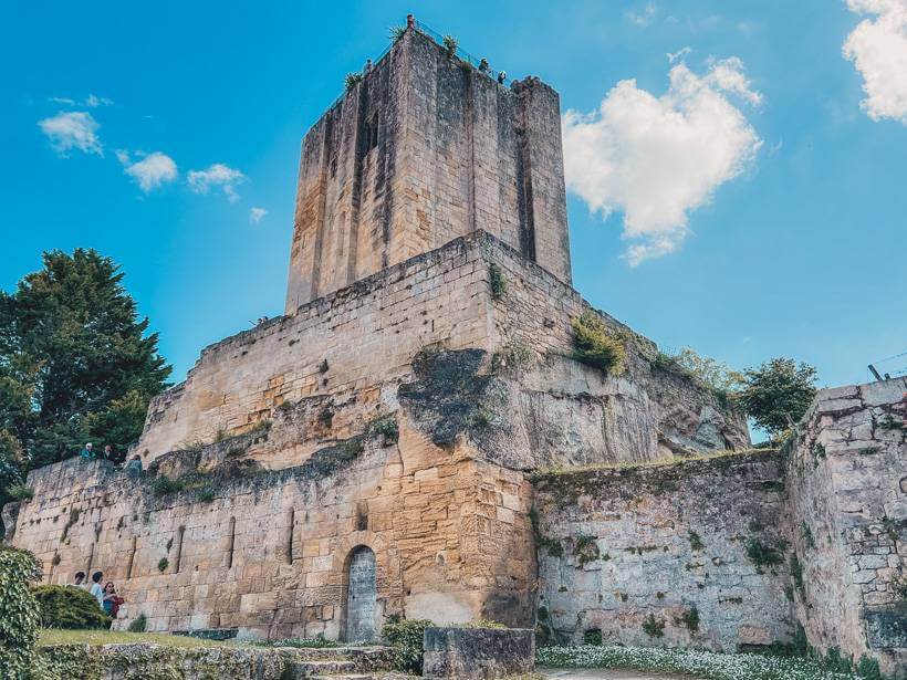 Tall four-sided structure of the King's Tower in Saint-Emilion, France during a day trip